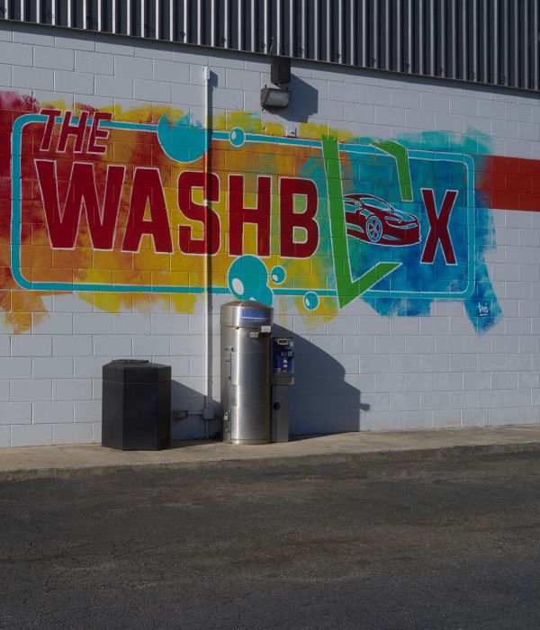 The Washbox Car Wash Mural And Flag At Building Entrance